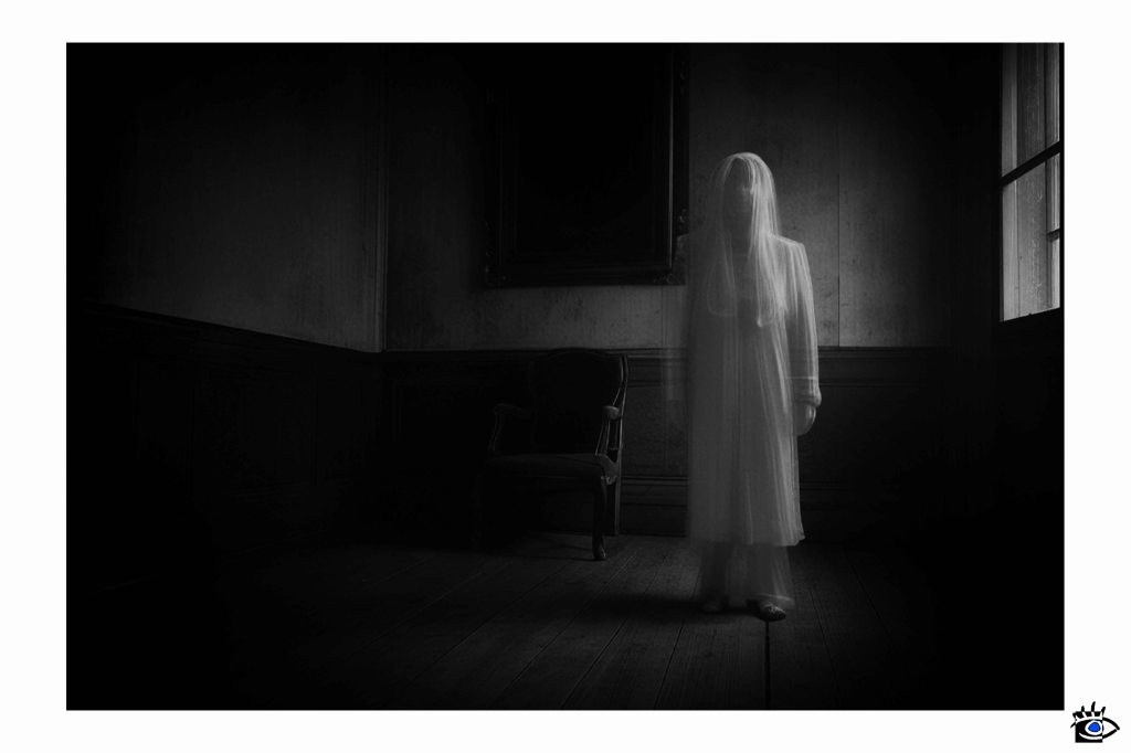 Ghostly figure in empty room.